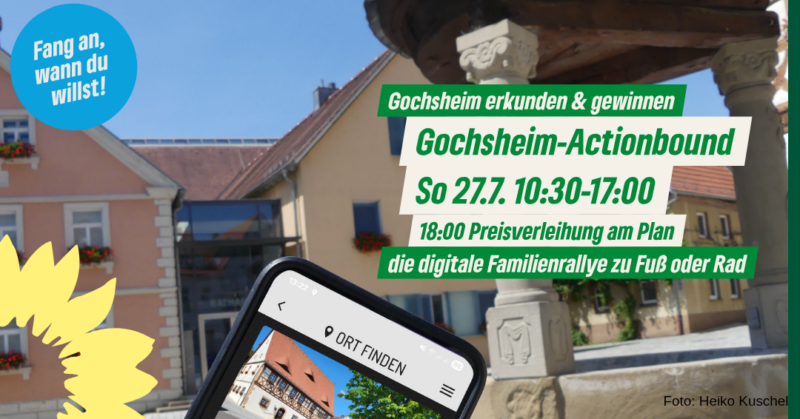 Ein Foto vom Plan, Rathaus im Hintergrund, vorne schräg ein Smartphone mit einer Seite aus dem Actionbound. Text: Gochsheim erkunden und gewinnen! Gochsheim-Actionbound So 27.7. 10:30-17:00 18:00 Preisverleihung am Plan die digitale Familienrallye zu Fuß oder Rad